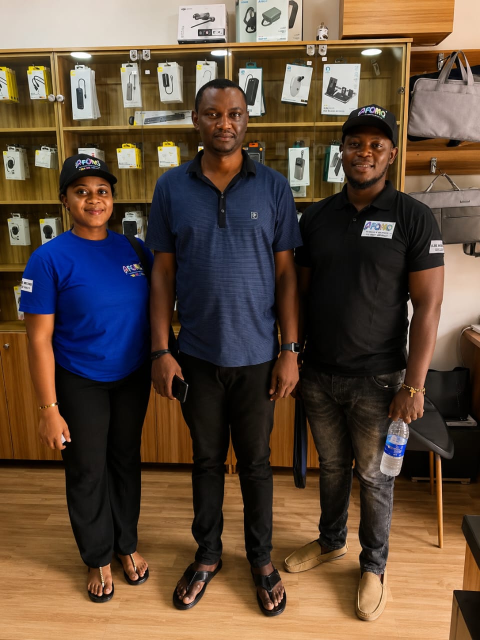 Afomo pilot team at a gadget store in Abuja